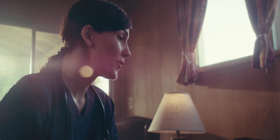 A female doctor is performing a home care visit