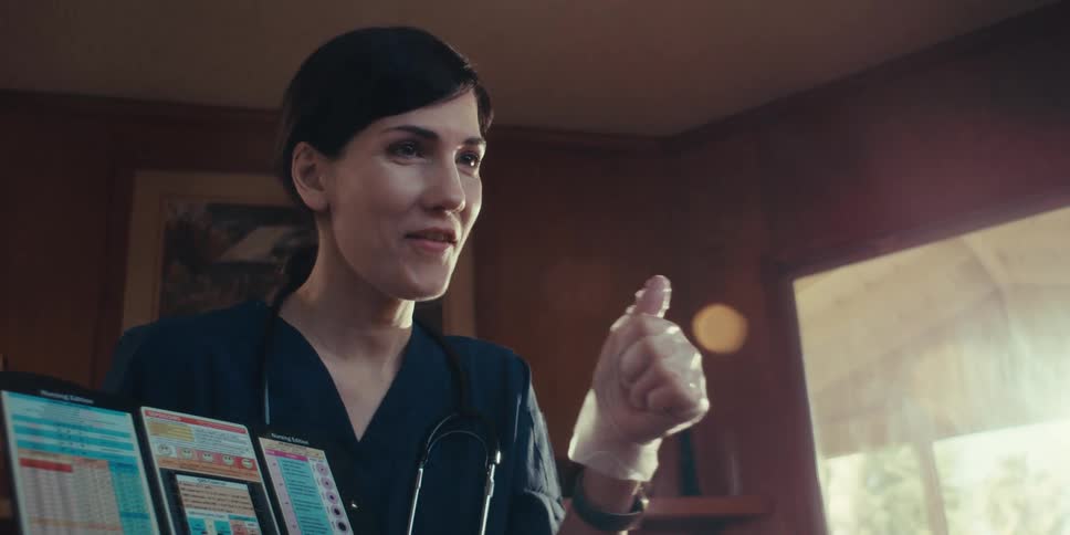 A footage of a female doctor showing a thumbs up
