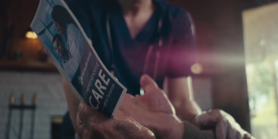 A patient is reading a brochure with the nurse