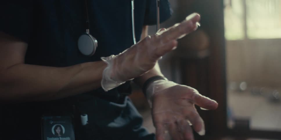 A nurse is moving her hands while she talks