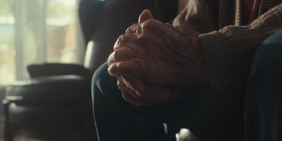 A man is rubbing his hands together