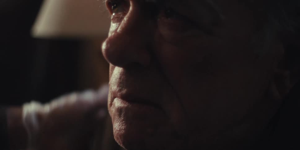 A footage of a person consoling an elderly man
