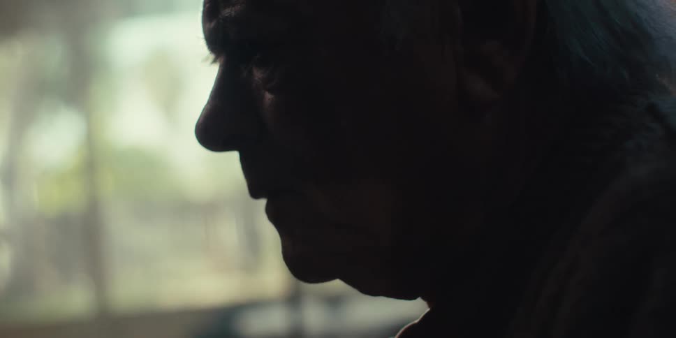 A man is sad in the dark room
