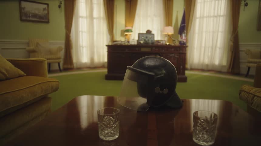 A motorcycle helmet sits on a coffee table
