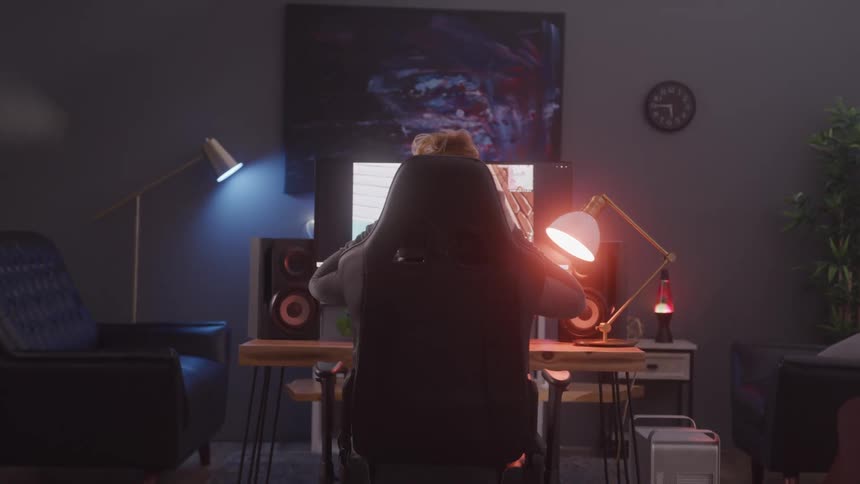 A footage of a person operating a computer indoor