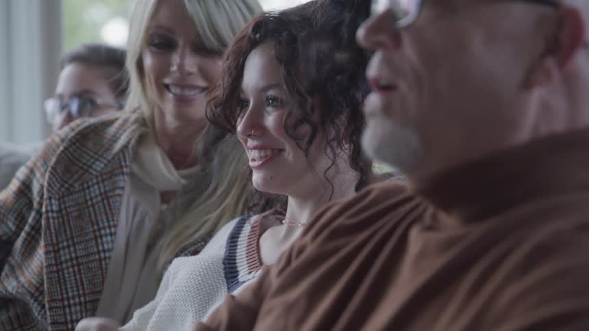 A family sits and talks together