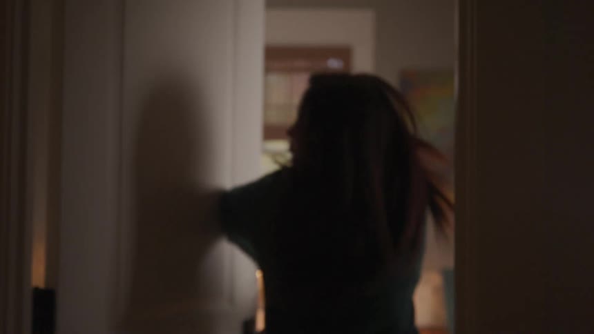 An angry female teenager slams her bedroom door