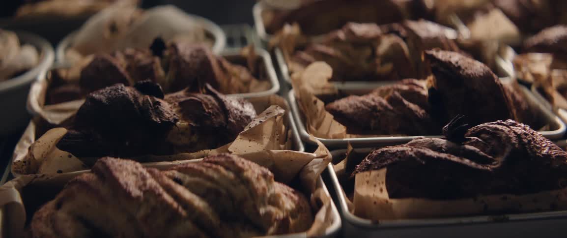 Rows of freshly baked breads on a table