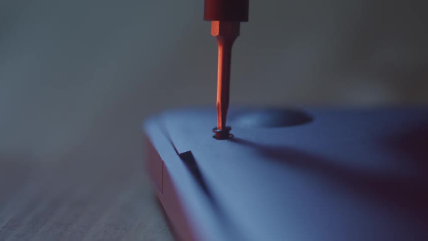 Tool removing a screw from a hardware