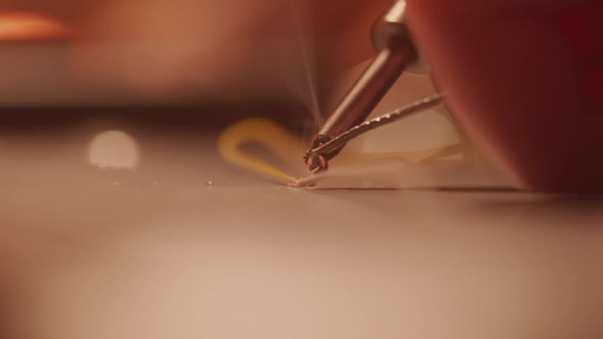 A footage of a person making use of a soldering iron