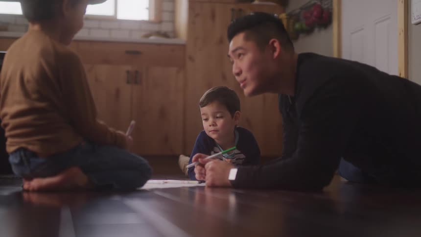 A footage of a man teaching children indoor