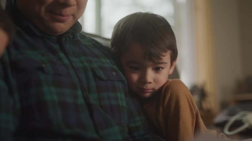 A footage of a man conversing with children