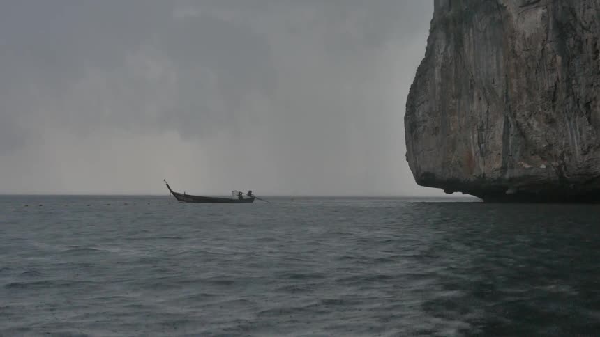 A boat floats on the ocean