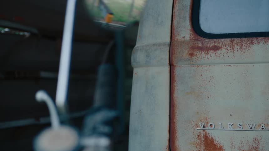Close up of the rear of a rusty vehicle