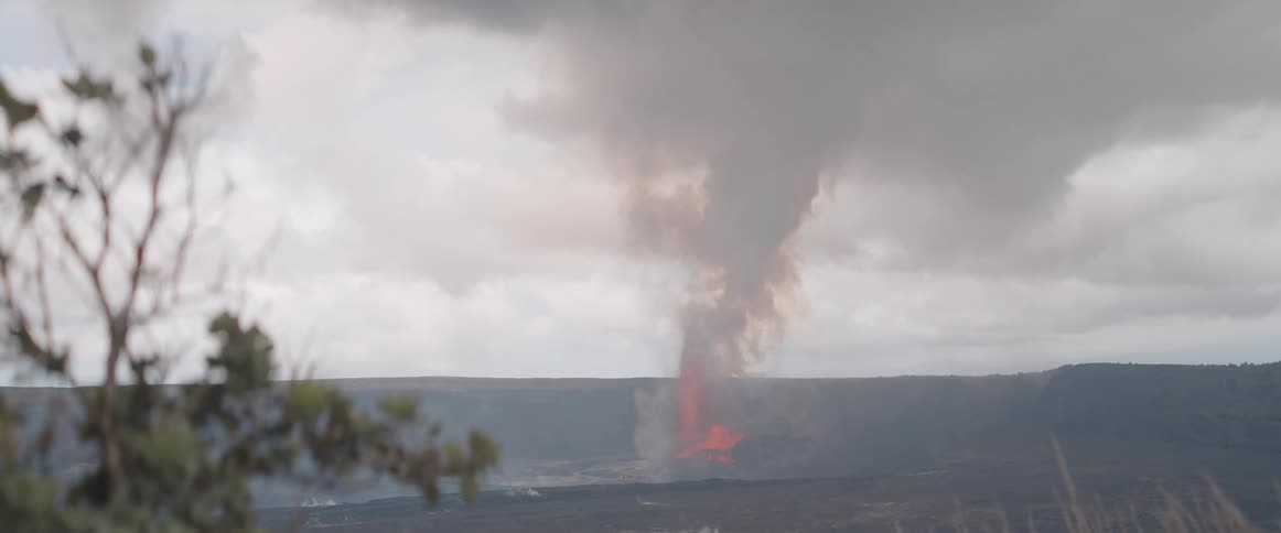 Natural landscape with fire erupting and smoke on the horizon