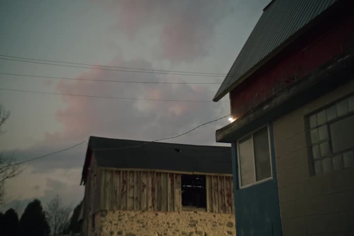 Houses in a rural setting on a cloudy dawn