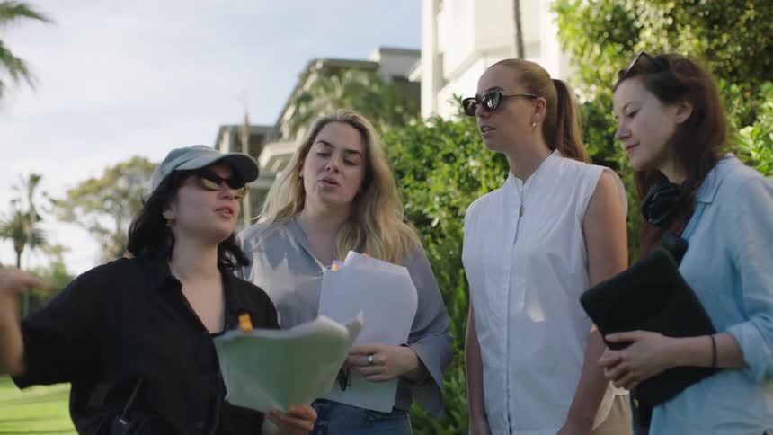 A group of women are talking together