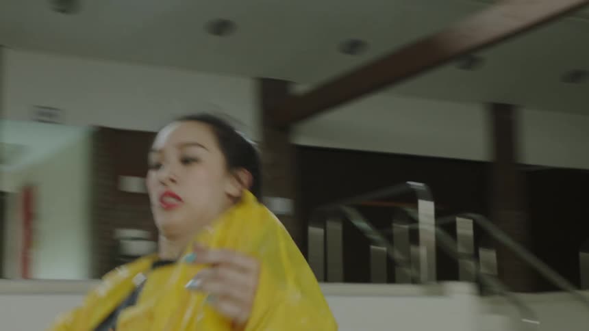 Woman dances in an empty pool indoors