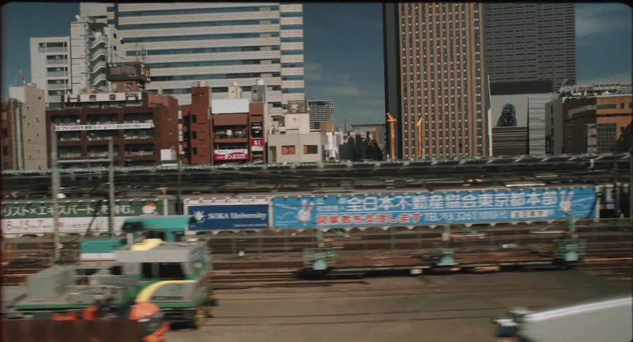 Train tracks run along the skyline