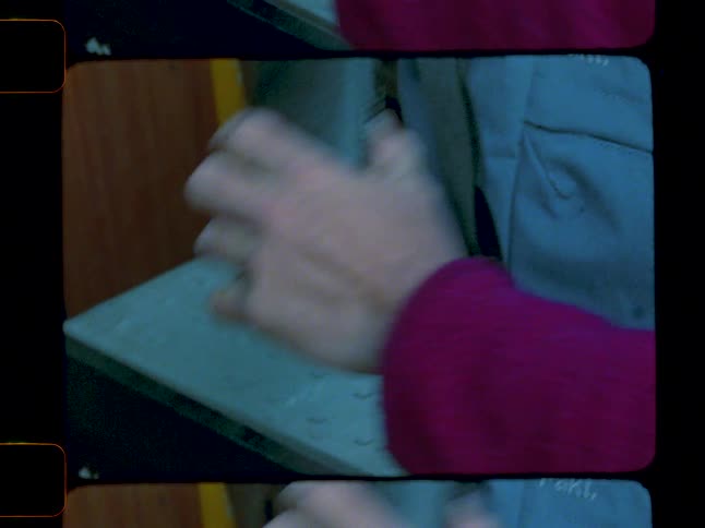 Person putting a device inside a backpack
