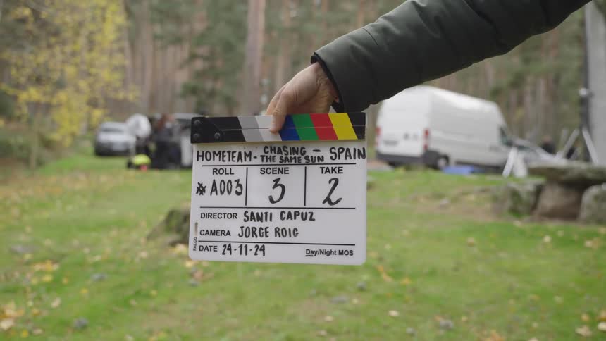 Person presses a film clapperboard