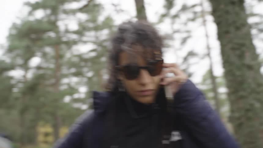 Two film makers talk in the woods