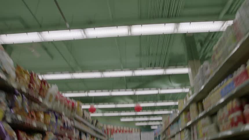 Traveling view of a grocery store aisle