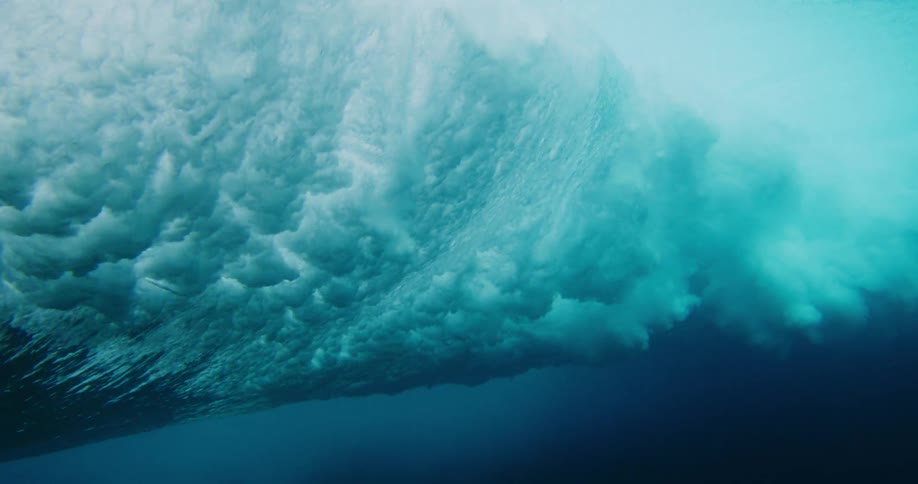 View of the ocean with a tubular wave breaking