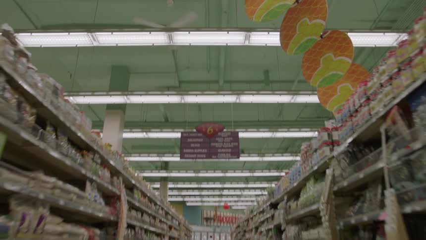 Fluorescent lights on the ceiling of a grocery store