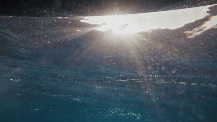 Underwater view close to the surface with reflections of sunlight