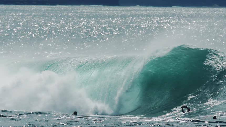 Person performing and surfing a tubular wave