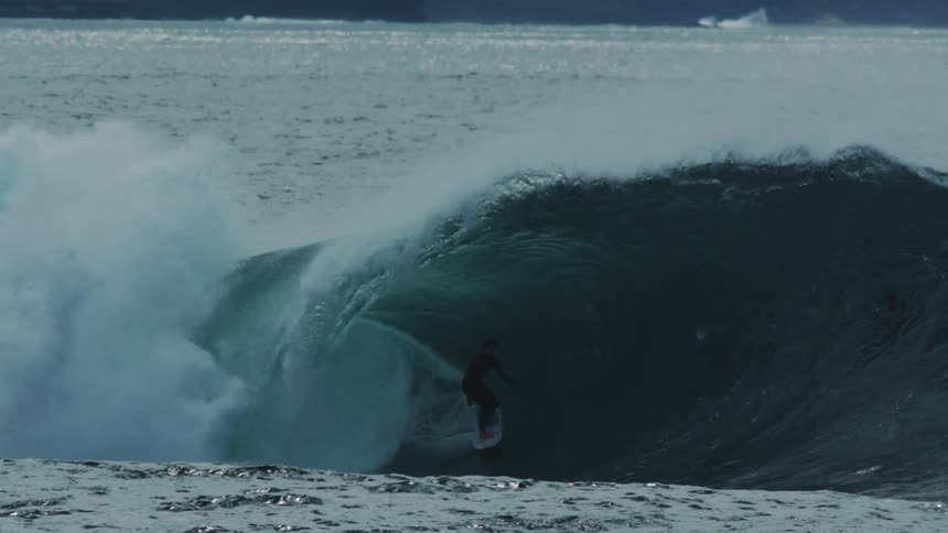Person inside a tubular wave in the ocean