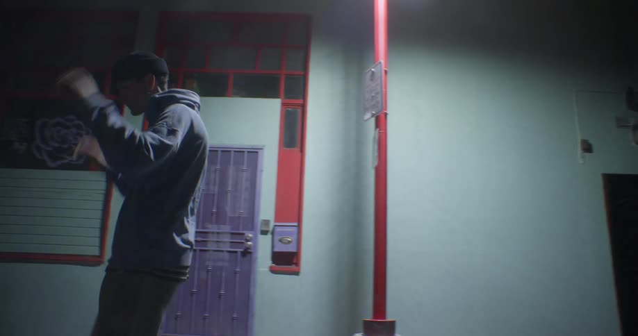 A teenager is walking in a circle in the city