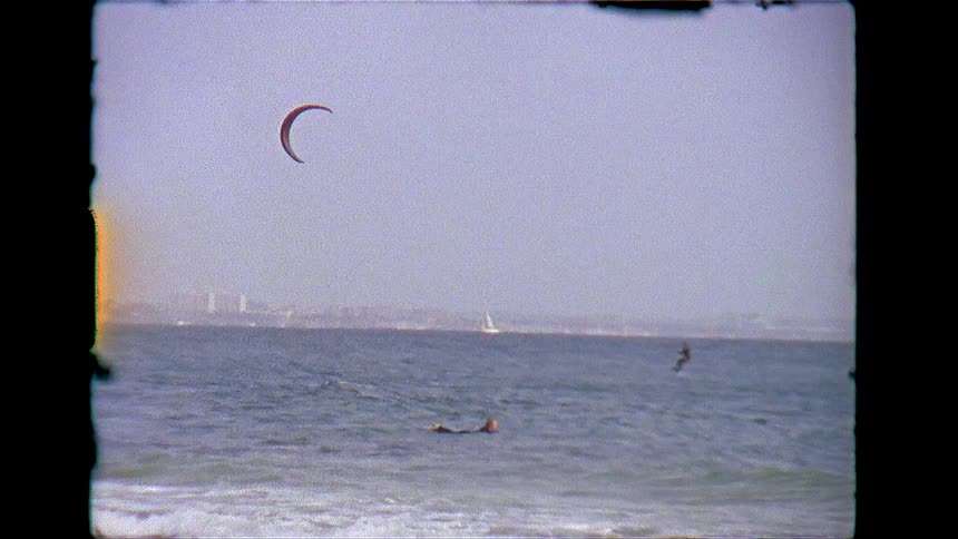 A person is kite boarding in the ocean