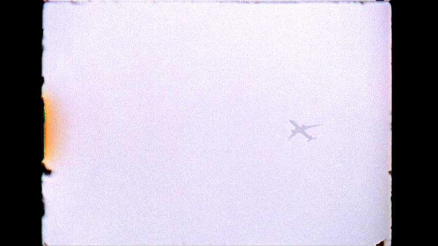 Airplane moves through the sky during the daytime