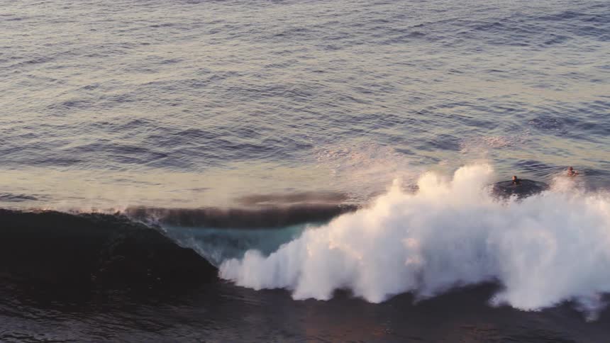 People are surfing in the ocean