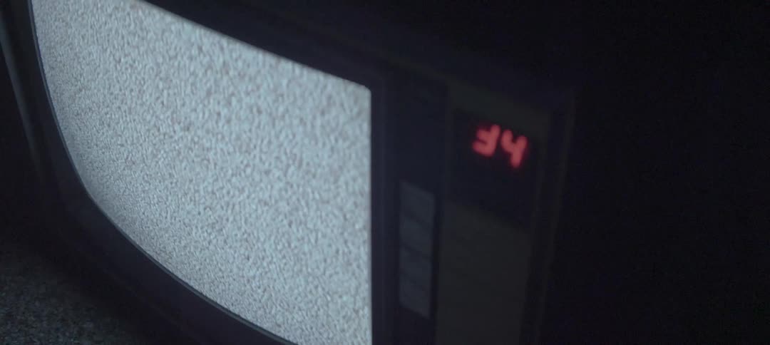 An old style tv is set to channel 34 but only displays static
