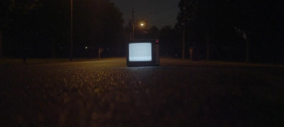Tv flickering static outside on the pavement