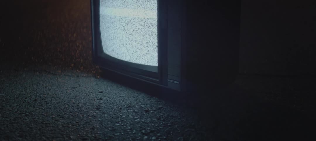 Tv flickering static outside on the pavement