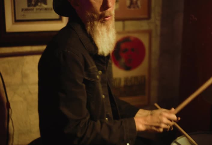 A man is playing the drums