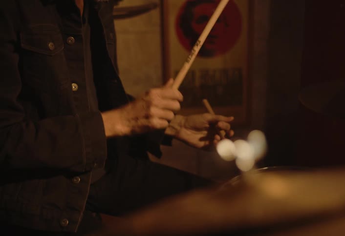 A footage of a person drumming