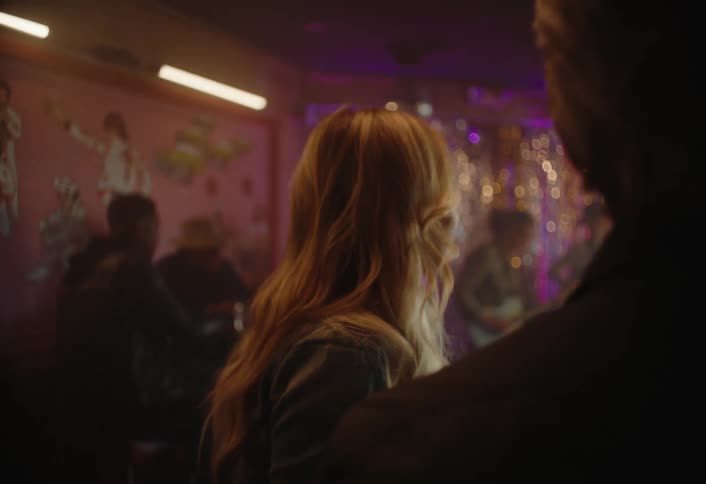People inside a bar enjoying live music