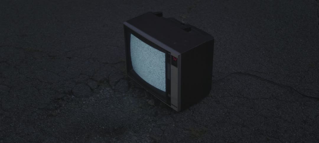 Flickering tv outside on the pavement