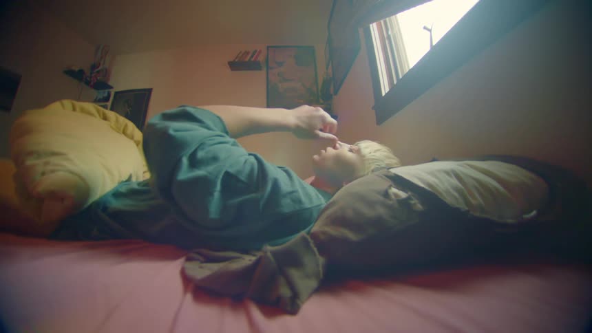 A woman wakes up and rolls over