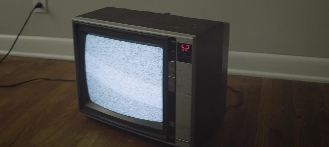 Tv showing static plugged in on the floor
