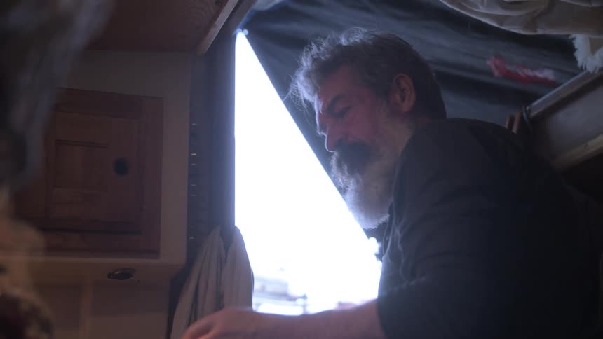Man cooking in a small kitchen