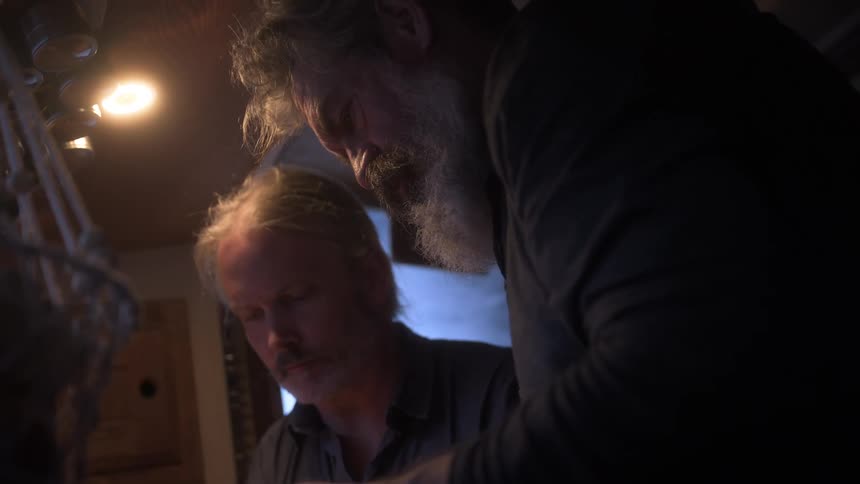 A footage of two men indoor