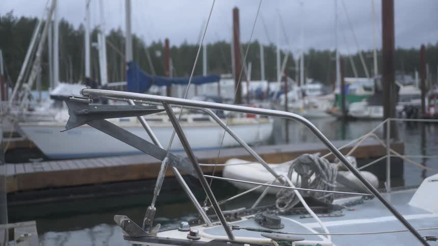 A yacht gently rocks in the water while docked in a marina
