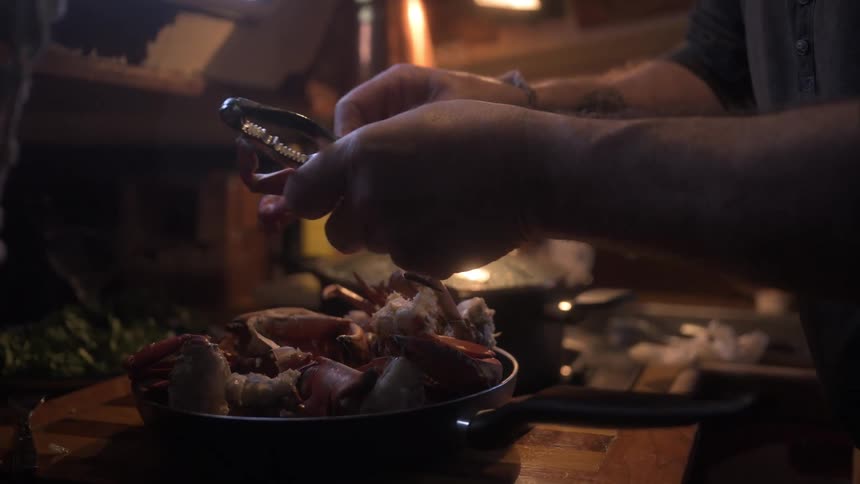 Pair of hands cooking crab