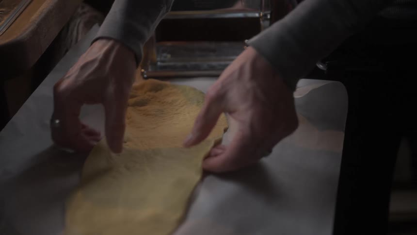 Hand of a person cooking pasta